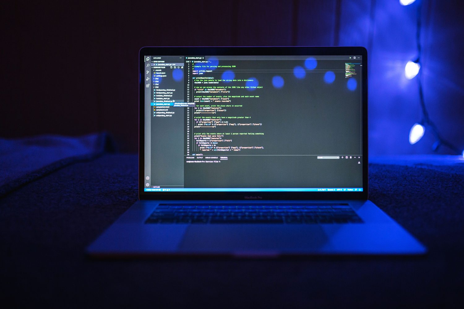 A laptop displaying software development code