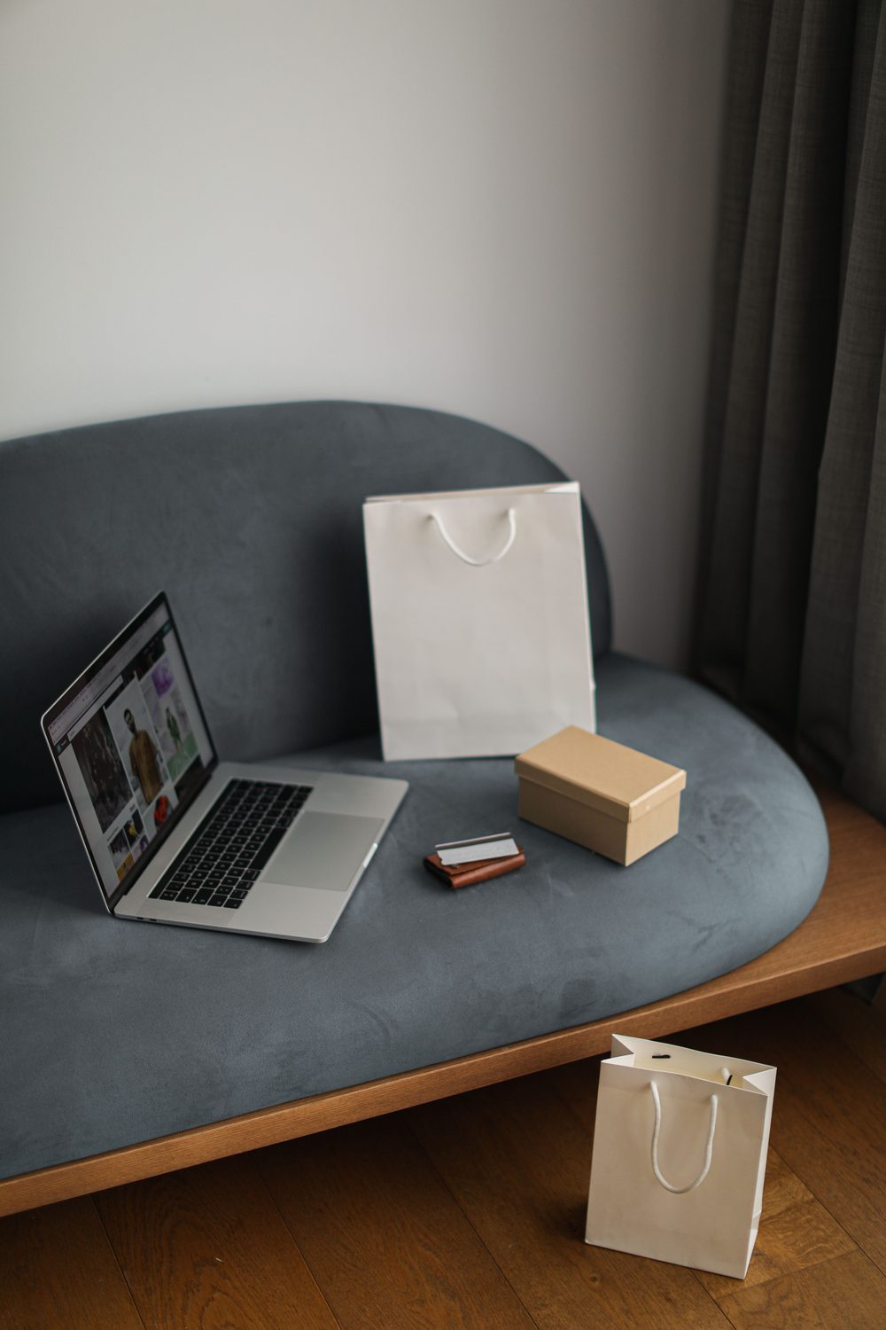 A laptop and shopping packages representing an online marketplace